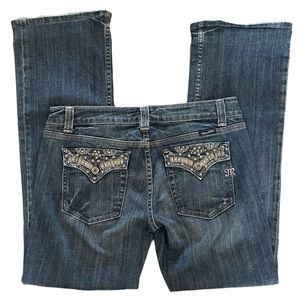 Miss Me Jeans, dark with embellishments and flap pocket.